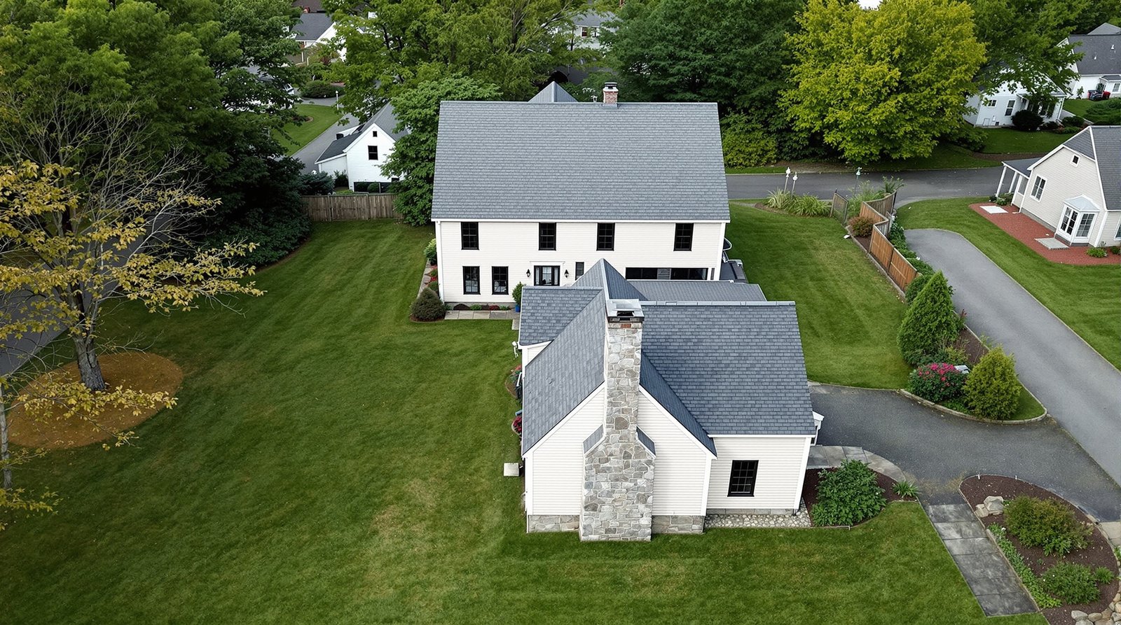 Aerial view of New Hampshire property with backyard ADU